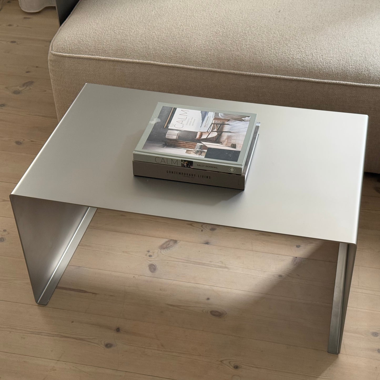 Front view of the Elegance Coffee Table with satin-matte stainless steel finish.