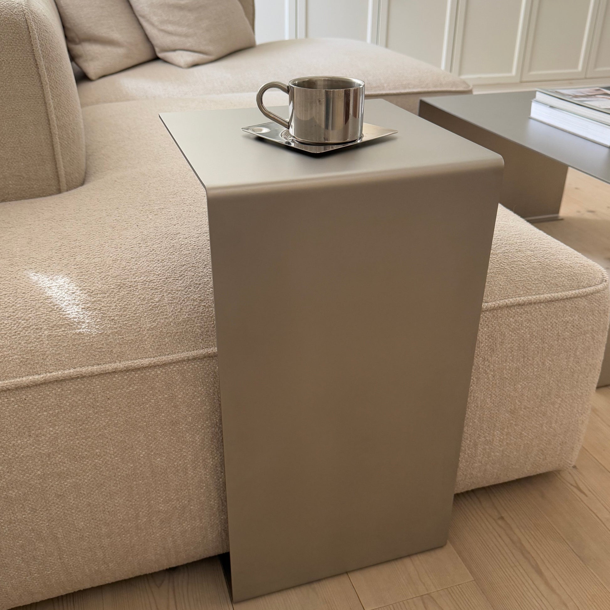 Front composition with the Elegance Side Table and a glimpse of the Coffee Table in the background.