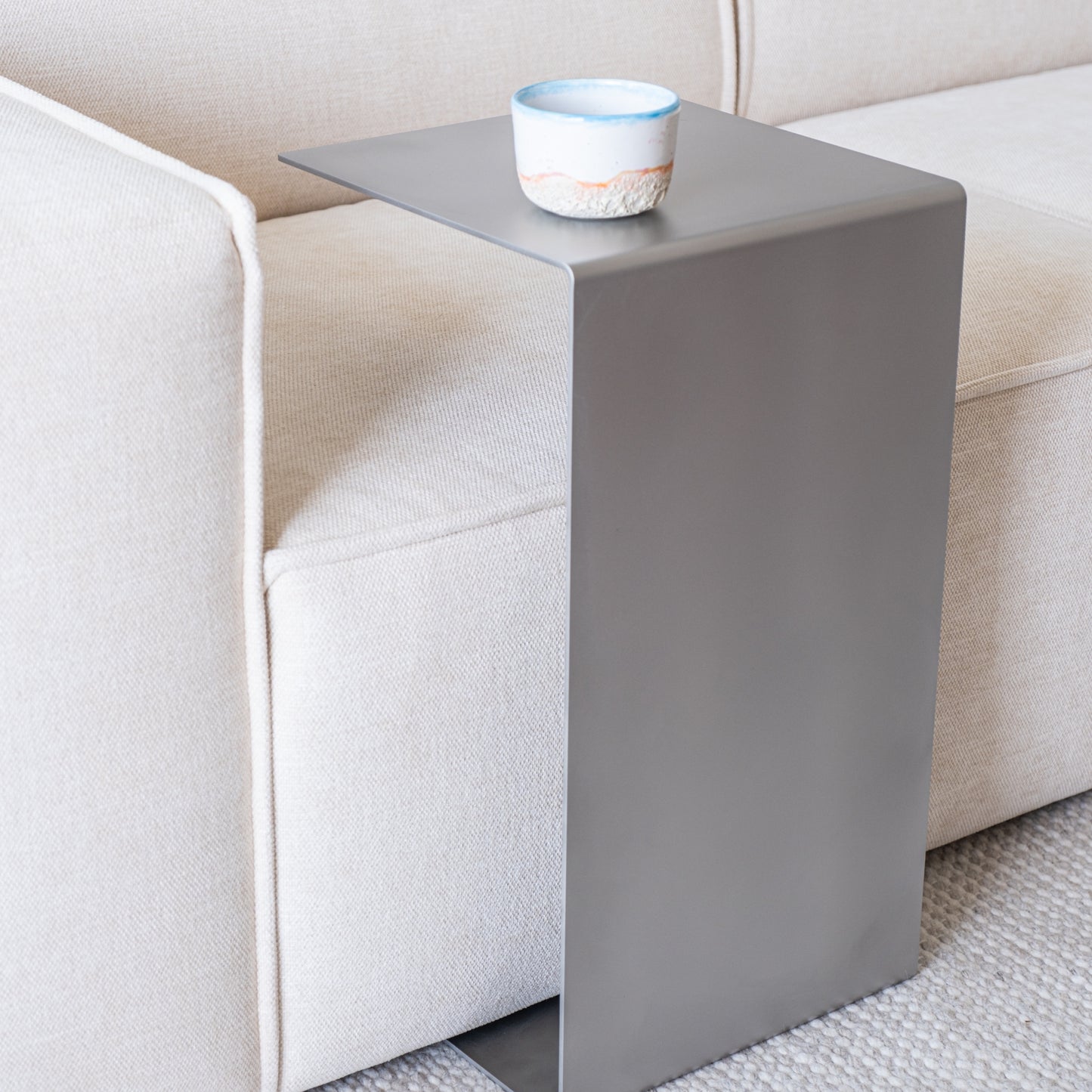 Angled view of the Elegance Side Table in a new living room setting.